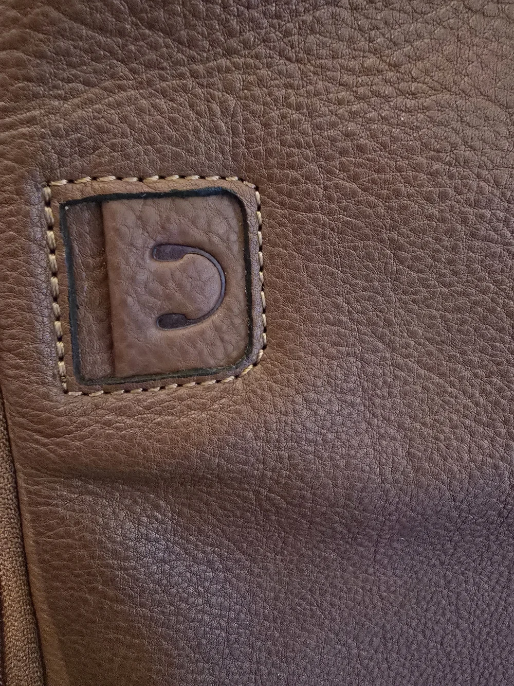 Genicci tan backpack